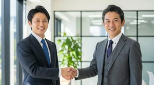 握手する男性2人の画像