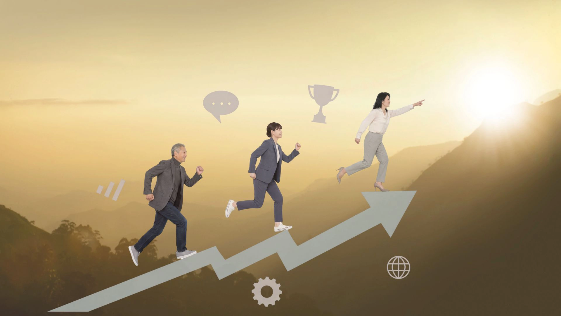 日に向かって走り出している男女3人の画像